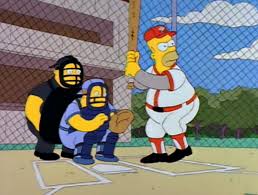 Homer Simpson wins the game for Springfield.