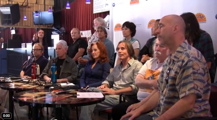 Bonnie Raitt, Jackson Browne, Graham Nash, et al, at a press conference before the August 2011 Musicians United for Safe Energy concert in Mountain View, California. They're talking about nuclear power, not chord changes or stage decor.