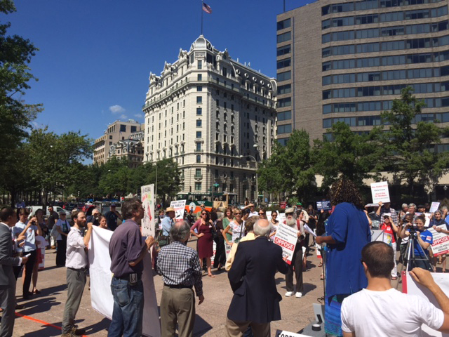 Washington DC residents rally outside the District Building September 17, 2015 against Exelon's proposed takeover of Pepco.